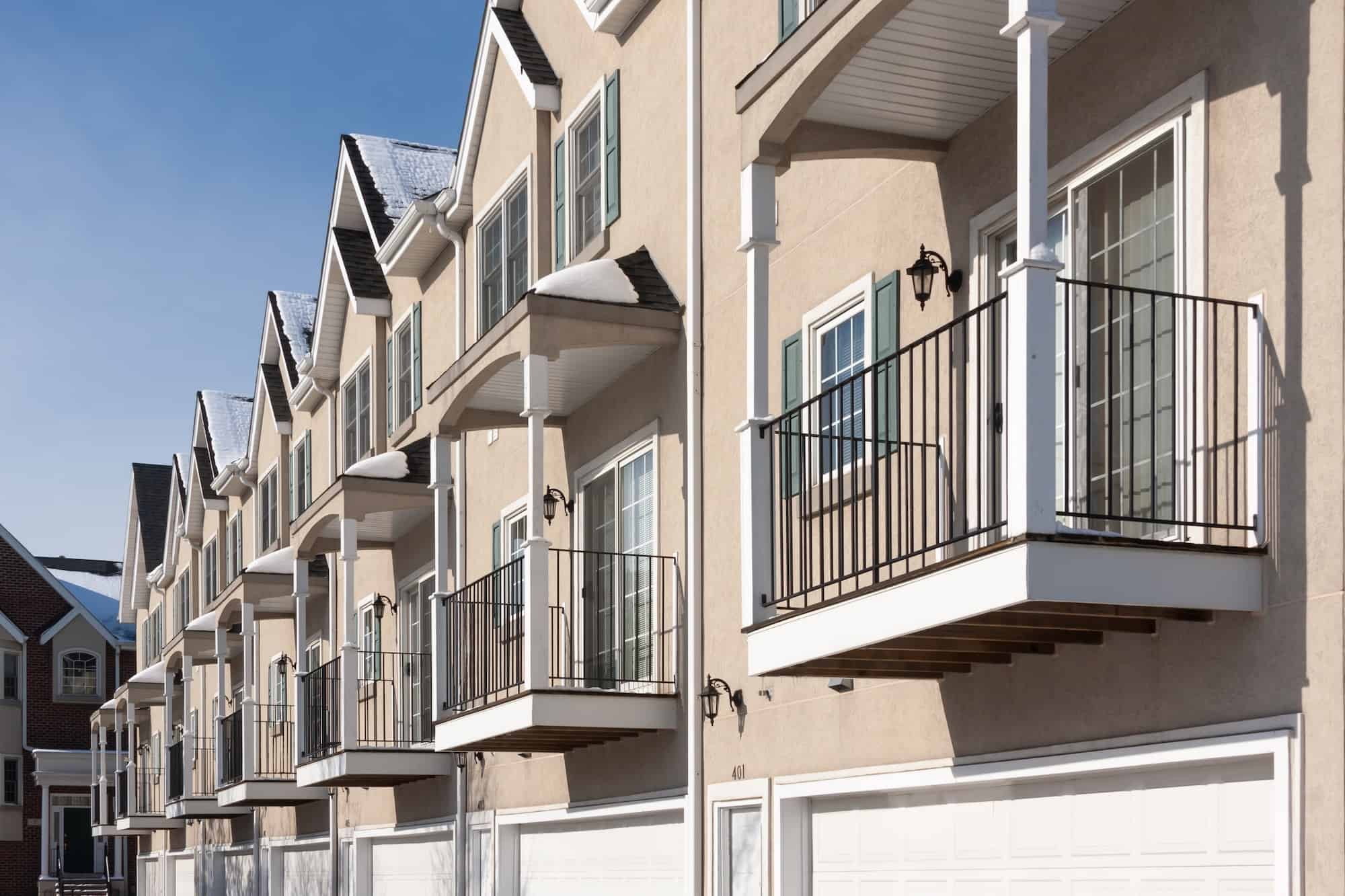 row-of-apartment-condominiums-balconies-and-garage-doors-.jpg